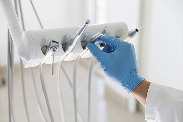 Professional Tooth Extraction technician working in Royal Palm Estates, FL